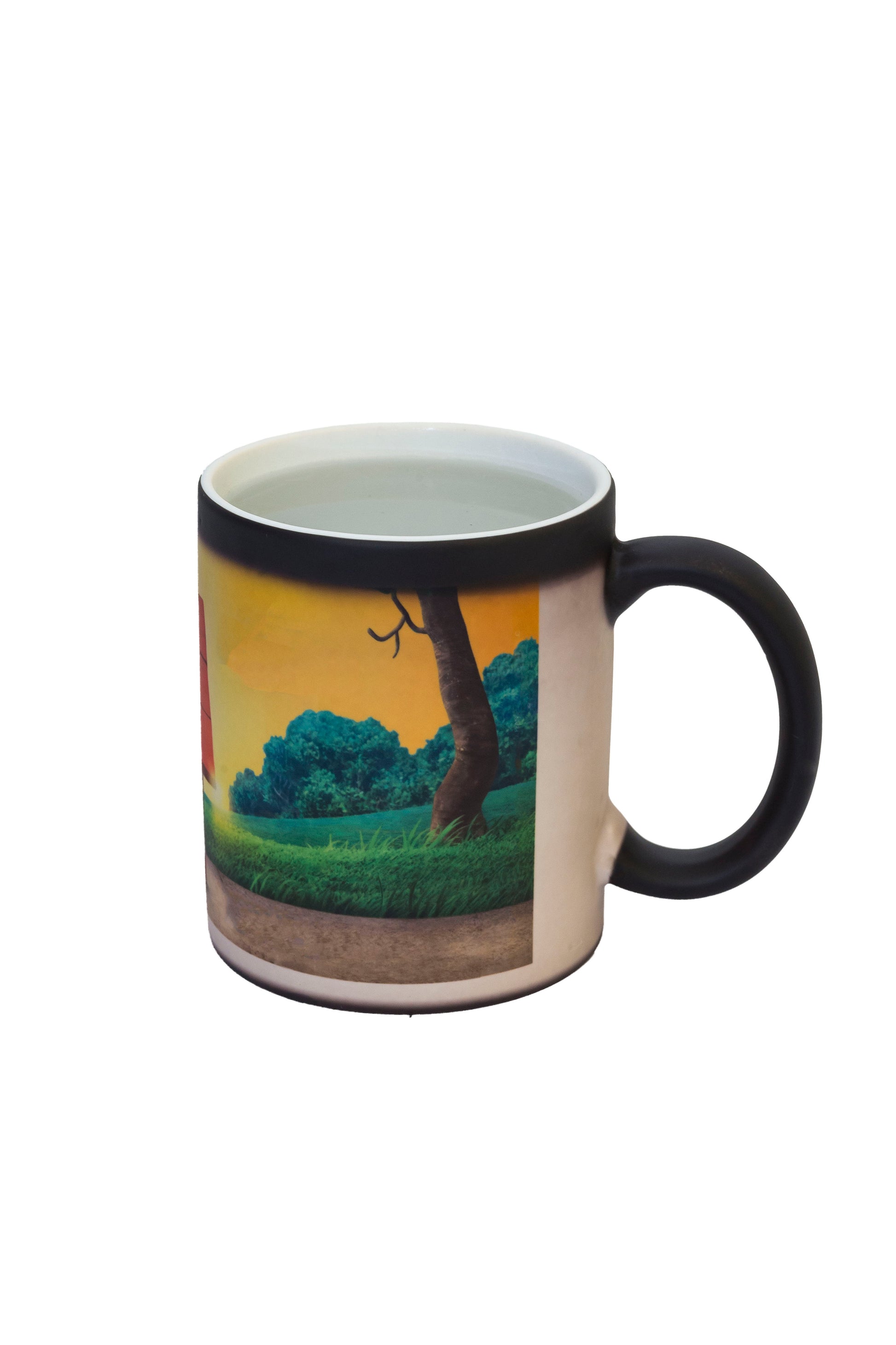 Black color changing mug revealing a vibrant landscape scene when filled with hot liquid